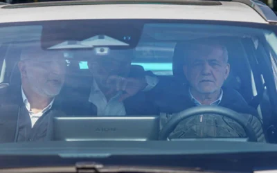The Iranian president travels in a taxi after his motorcade breaks down due to fuel contamination.
